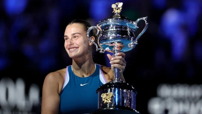 Aryna Sabalenka lifting the 2023 AO cup