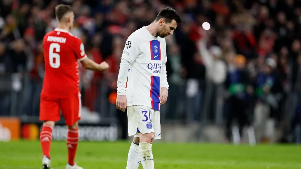 Leonel Messi looking down after being defeated by Bayern Munich. Joshua Kimmich celebrating in the back ground