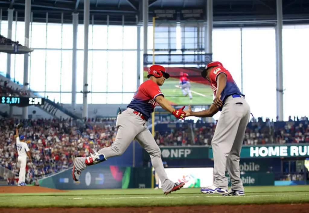 The Platano Power team (the dominican Republic) vs Nicaragua in the 2023 World Baseball Classic. Juan Soto giving a highfive to a felow teamate as he scores his first home run of the tournament