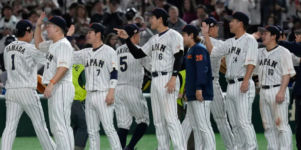 The players from Japan celebrating after passing into the semifinals with their victory against Italy