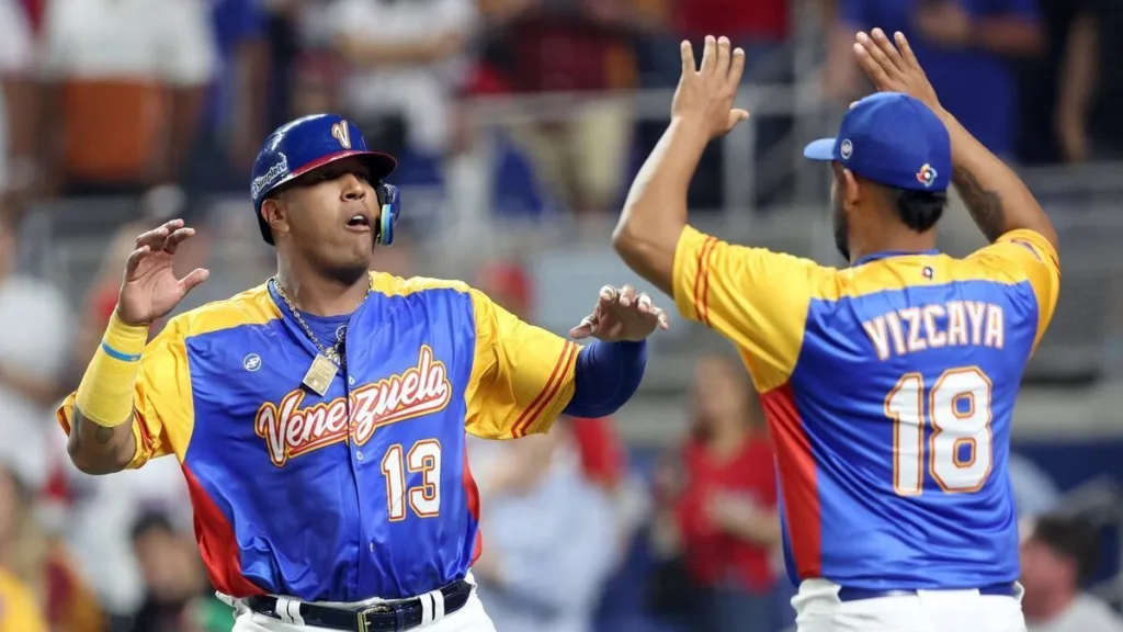 Venezuelas players celebrating in their victory against the Domincian Repubic in the Baseball world slassic opening game for both teams 