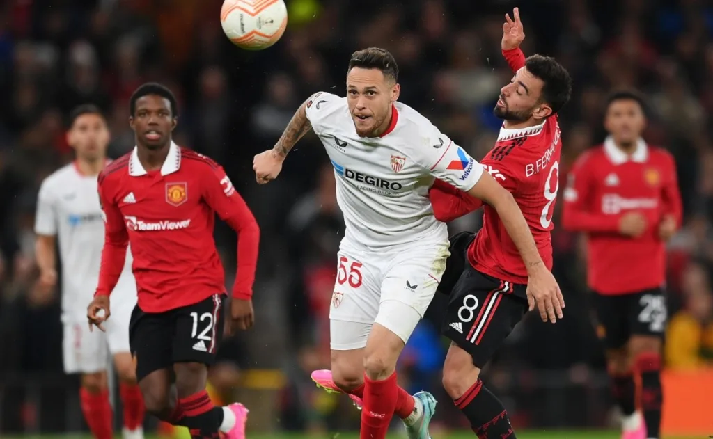 Man United and Sevilla players fighting for the ball at their clash in the Europa League