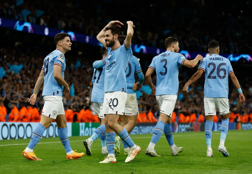 Bernardo Silva and his Manchester City teammates celebrating after Julian Alvares scored the fourth goal against Real Madrid to pass the 2023 UEFA Champions League final