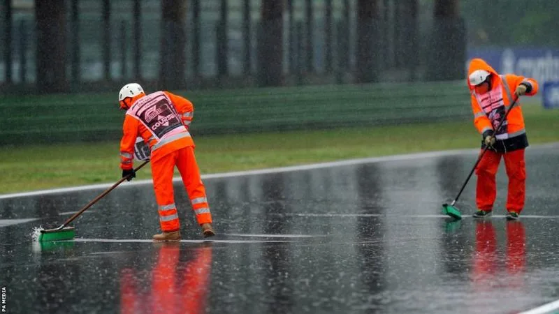 F1 race controllers cleaning the Emilia Romagna track after the heavy rains that have flooded the region 