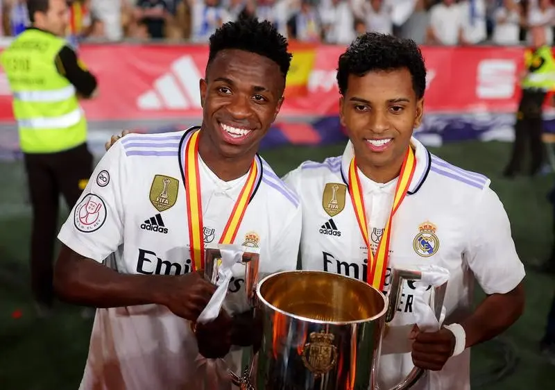 Rodrygo and Vinicius Jr with the Copa del Rey trophy in their hands