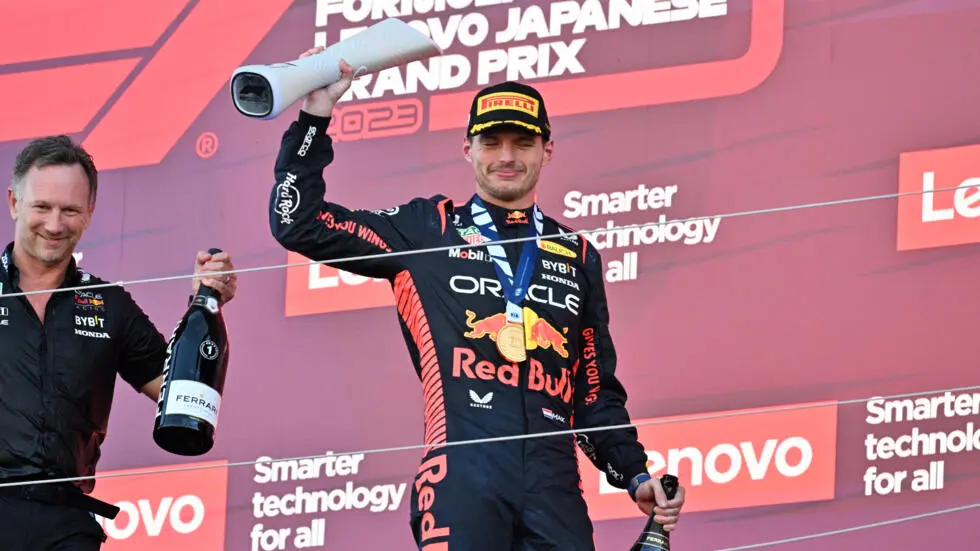 Max Verstappen with his 2023 Japanese GP trophy with Christian Horner in the back as Red Bull won the 2023 Constructors Championship 