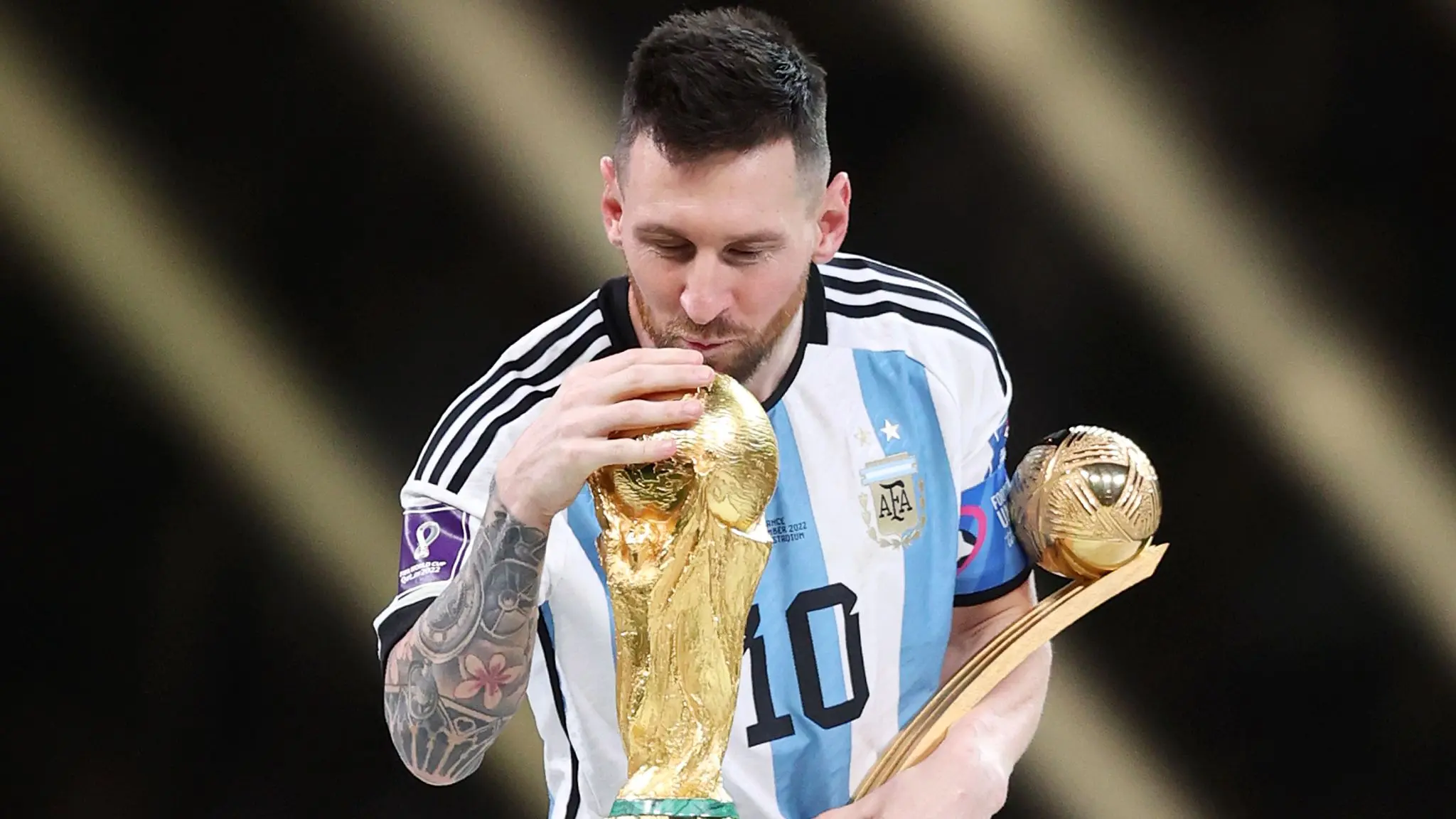 Lionel Messi with the World Cup golden ball and trophy after being announced as the Ballon d'Or 2023 winner