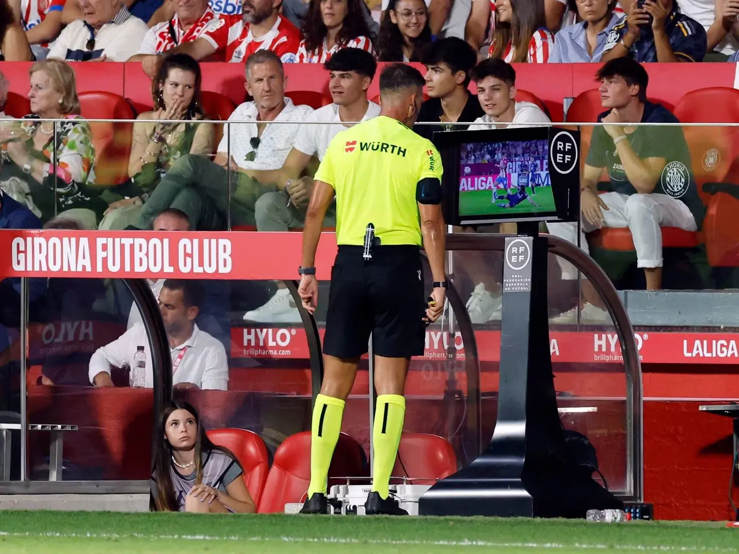 Referee in spain looking at the VAR monitor to decide if his call was right or not