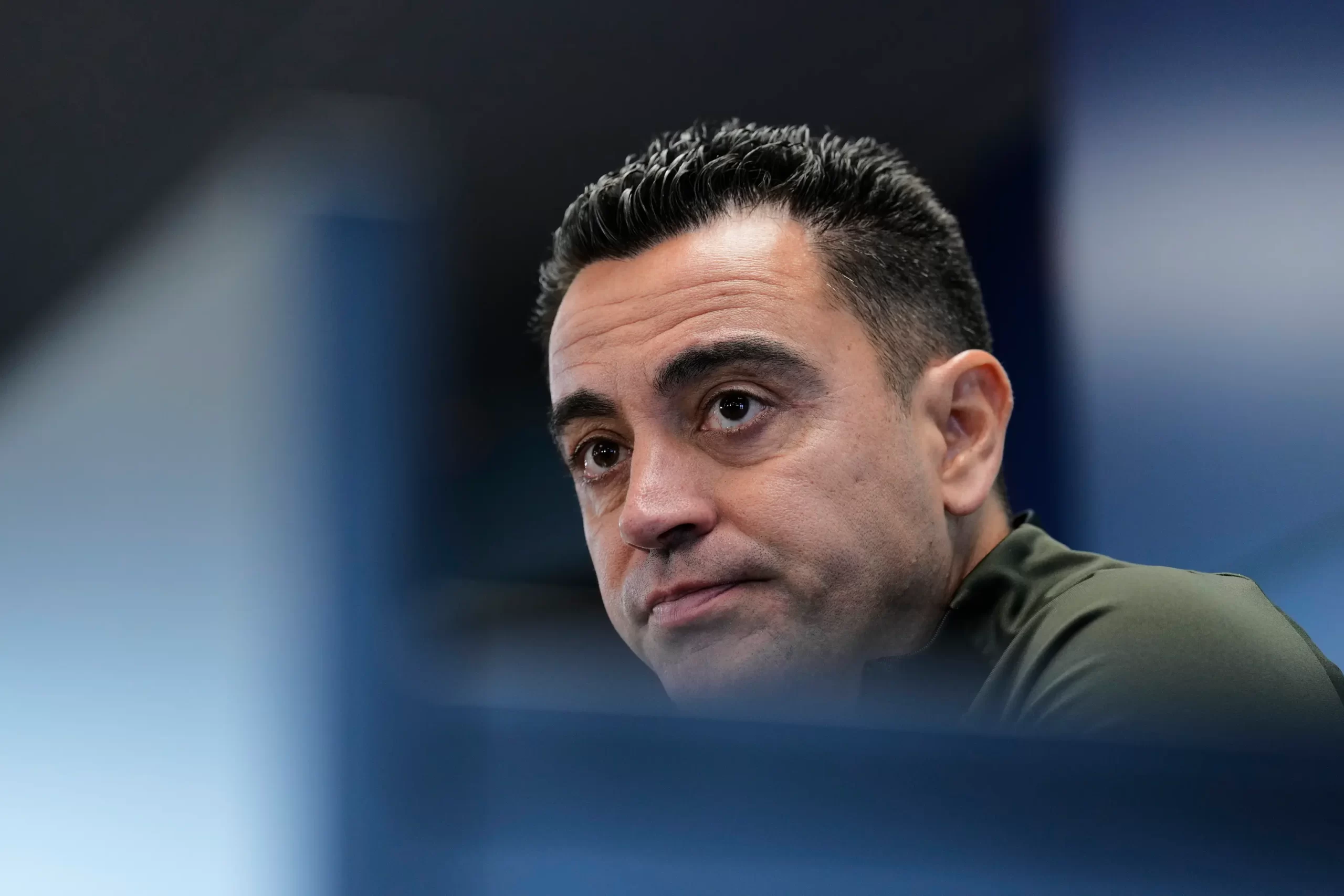 Xavi Hernández looking disappointed after announcing his departure from Barcelona